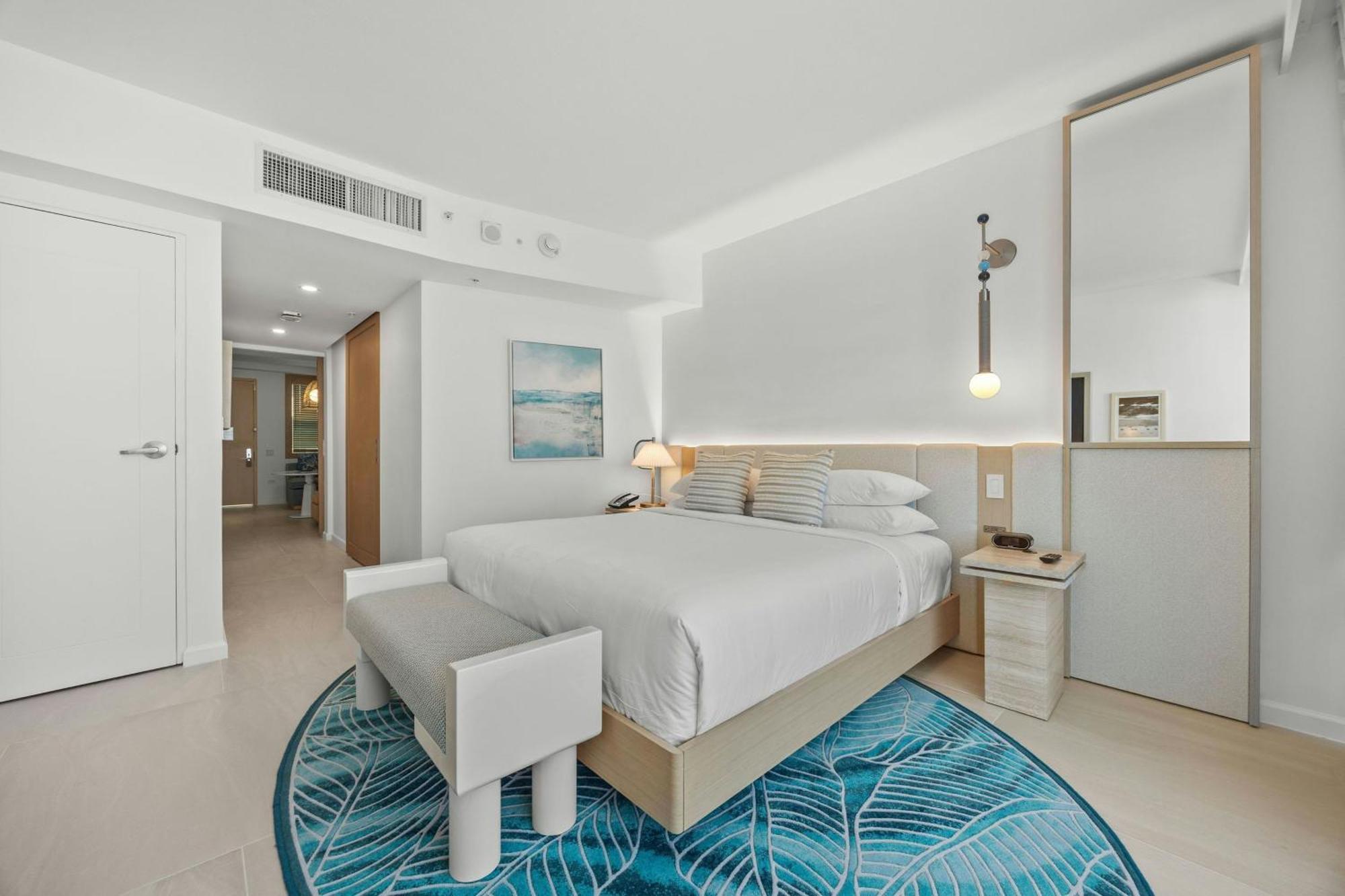 One-Bedroom Deluxe King Suite Sofa Bed Partial Ocean View